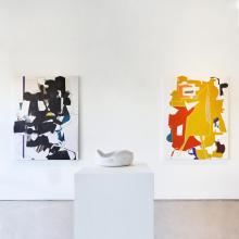 two large aaron wexler abstract collages behind a yasha butler ceramic vesssel 