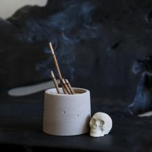 incense burner and skull